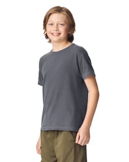 A grey youth short sleeve t-shirt displayed on a smiling child, featuring a simple design and crew neck.
