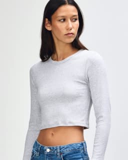 A grey long-sleeve crop fitted T-shirt for women, featuring a snug fit and a simple design, with branding.