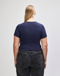 A navy blue fitted crop T-shirt with short sleeves, showcasing a simple design from the back.