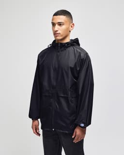A black full-zip anorak jacket with a hood and a logo, modelled by a person standing against a neutral background.