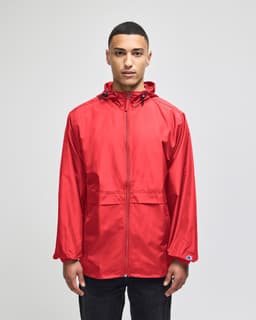 A red full-zip anorak jacket featuring a hood and a logo, designed for adult wear.