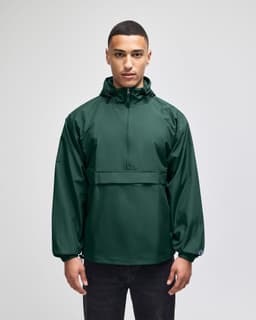 A green packable anorak jacket with a hood, featuring a front pocket and logo branding.