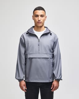 A grey packable anorak jacket with a hood, featuring a front pouch pocket and adjustable drawstrings.