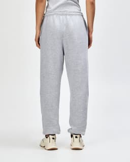 Unisex sweatpants in grey, featuring a relaxed fit and elasticised waistband. Includes a logo on the back.