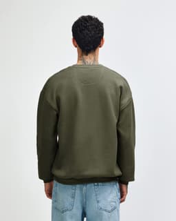 A unisex crewneck sweatshirt in olive green, featuring a relaxed fit and long sleeves, with a plain back view.