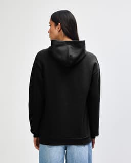 A black unisex hooded sweatshirt from American Apparel, viewed from the back. It has a relaxed fit and a hood.