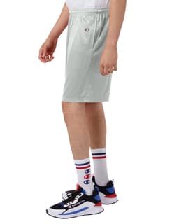 Light green mesh shorts with pockets, featuring a logo, displayed on a model wearing sporty shoes and socks.