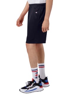 Navy sports shorts made of mesh, featuring pockets and a logo, displayed on a model with sporty shoes and socks.