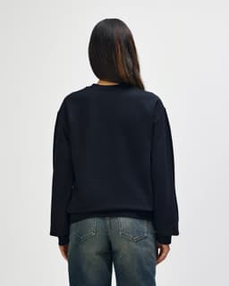 A black Gildan Softstyle adult sweatshirt, featuring a classic crew neckline and long sleeves, displayed from the back.