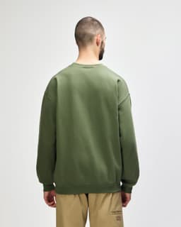 A green Gildan Softstyle adult sweatshirt is displayed from the back, featuring a simple design.