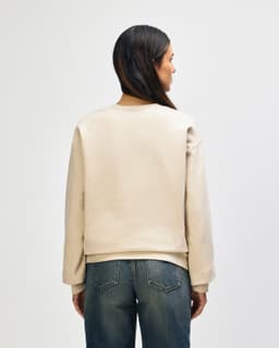A beige Gildan Softstyle adult sweatshirt, featuring a round neck and long sleeves, viewed from the back.