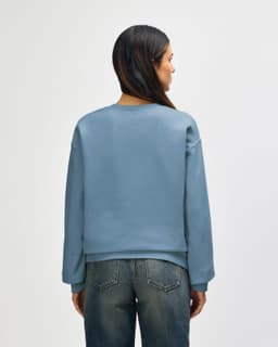 A blue Gildan Softstyle adult sweatshirt, featuring a crew neckline and long sleeves, viewed from the back.