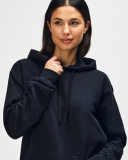 A black Gildan Softstyle adult hooded sweatshirt with a drawstring hood and a front pocket.