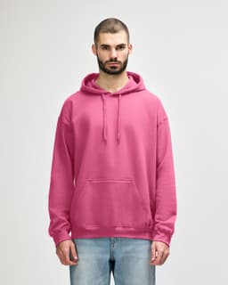A pink hooded sweatshirt with a front pocket and drawstring hood, worn by a model. Features a branding logo.