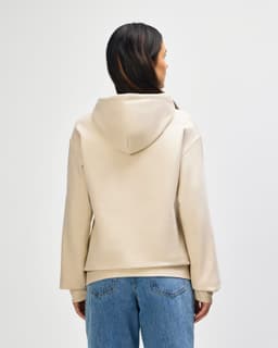A beige hooded sweatshirt with a back view and a hood, featuring long sleeves and a simple design.