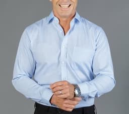 A light blue button-up shirt with a pocket, featuring a logo on the chest and a classic collar.