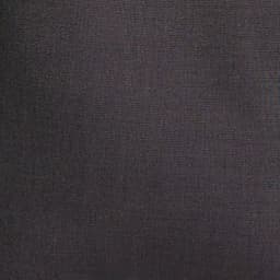 A pair of black slacks with a textured fabric, featuring a branding logo.