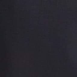 A close-up of black fabric, showcasing a smooth texture suitable for slacks. The image includes a logo.