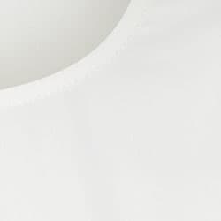 A white fabric close-up featuring a curved neckline and soft texture. The material has a smooth finish.