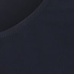 A close-up view of a navy fabric with a smooth texture, featuring a round neckline and neat stitching.