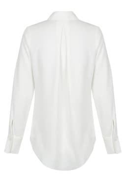 A white Quinn 1/2 Placket shirt featuring long sleeves and a back pleat design. It has a logo on the fabric.