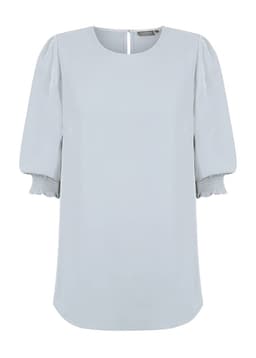 A light blue blouse featuring shirred cuffs and a subtle back closure. The design has a relaxed fit with soft fabric.