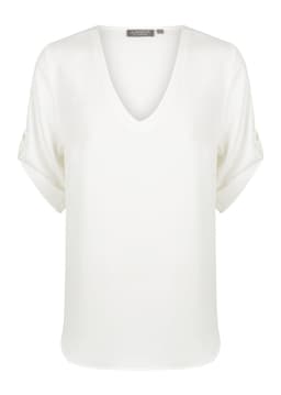 A white v-neck shirt with rolled sleeves and a subtle brand logo.