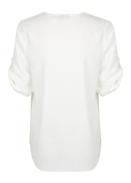 A white V-neck shirt with rolled sleeves and a smooth finish. It features a subtle logo on the back.