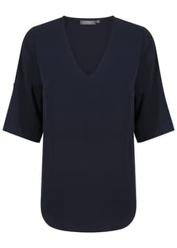 A navy blue V-neck shirt with short sleeves and a logo on the neckline.