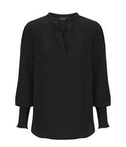 A black long sleeve top with a slight v-neck and textured cuffs. The top features a subtle, elegant design and has a logo.