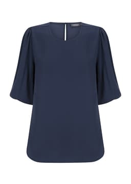 Navy blue Poppy Puff Sleeve Top with a relaxed fit and short puff sleeves. It features a subtle back opening and includes a logo.