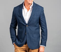 A blue blazer with a tailored fit, featuring two front pockets and a button closure.