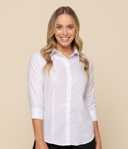 A model wearing a white button-up shirt with three-quarter sleeves, featuring a logo on the chest.