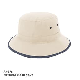 A beige microfibre bucket hat with a dark navy brim, featuring ventilation eyelets and a logo.