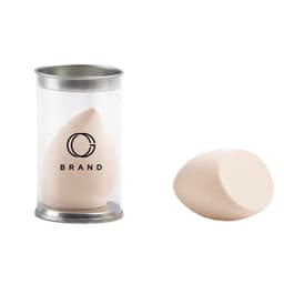A beauty makeup sponge in a transparent container, featuring a rounded shape and a light beige colour.