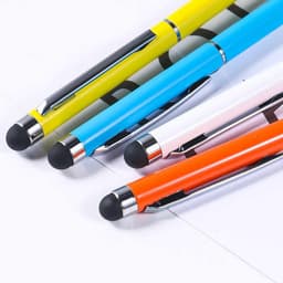 A collection of four stylus ballpoint pens in yellow, blue, white, and orange, with a logo on one pen.