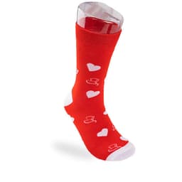 A red sock with white heart and hat patterns, displayed on a clear stand. It features a logo on the cuff.