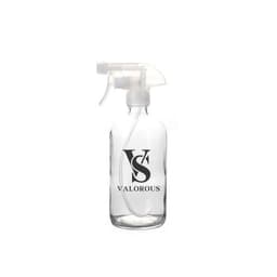 A clear glass spray bottle with a transparent nozzle, featuring a logo design.