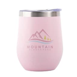 A pink stainless steel insulated wine tumbler with a lid and a logo featuring mountains and trees.
