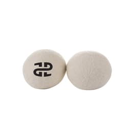 Two cream-coloured reusable wool dryer balls with a small logo on one ball.