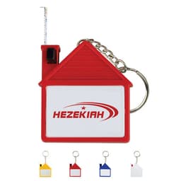 A house-shaped tape measure with key chain in red, featuring a branding logo and a retractable measuring tape.