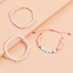 A set of three stretch plastic bracelets in pink and white, featuring decorative beads and a 'LOVE' charm.
