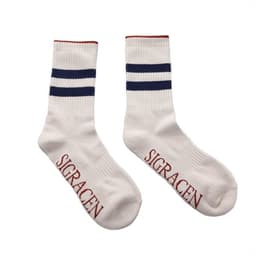 Striped tube crew socks in white with navy and red stripes, featuring branding on the soles.
