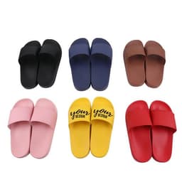 A collection of customised PVC sports slippers in black, navy, brown, pink, yellow, and red, featuring a logo on the yellow pair.