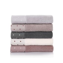 A stack of square cotton towels in shades of grey, pink, and cream, featuring varying textures and patterns.