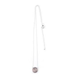A silver metal necklace featuring a round charm and a decorative chain with an adjustable clasp.