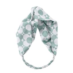 A mint green satin cross headband featuring a geometric pattern in white. It has an elasticated band for comfort.