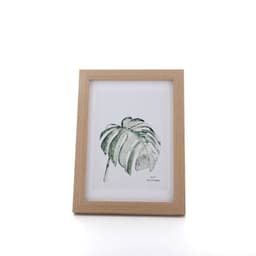 A personalised 7-inch photo frame in natural wood, displaying a botanical print of a leaf.