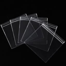 A set of clear plastic seal bags in various sizes, featuring a zip-lock closure and arranged on a black background.