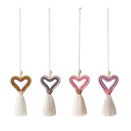 Knitted heart-shaped car pendants in pink, purple, green, and cream, each featuring a tassel. Decorative and colourful novelty items.